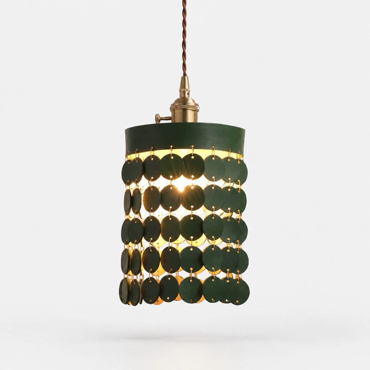 Green leather pendant light on a white background
