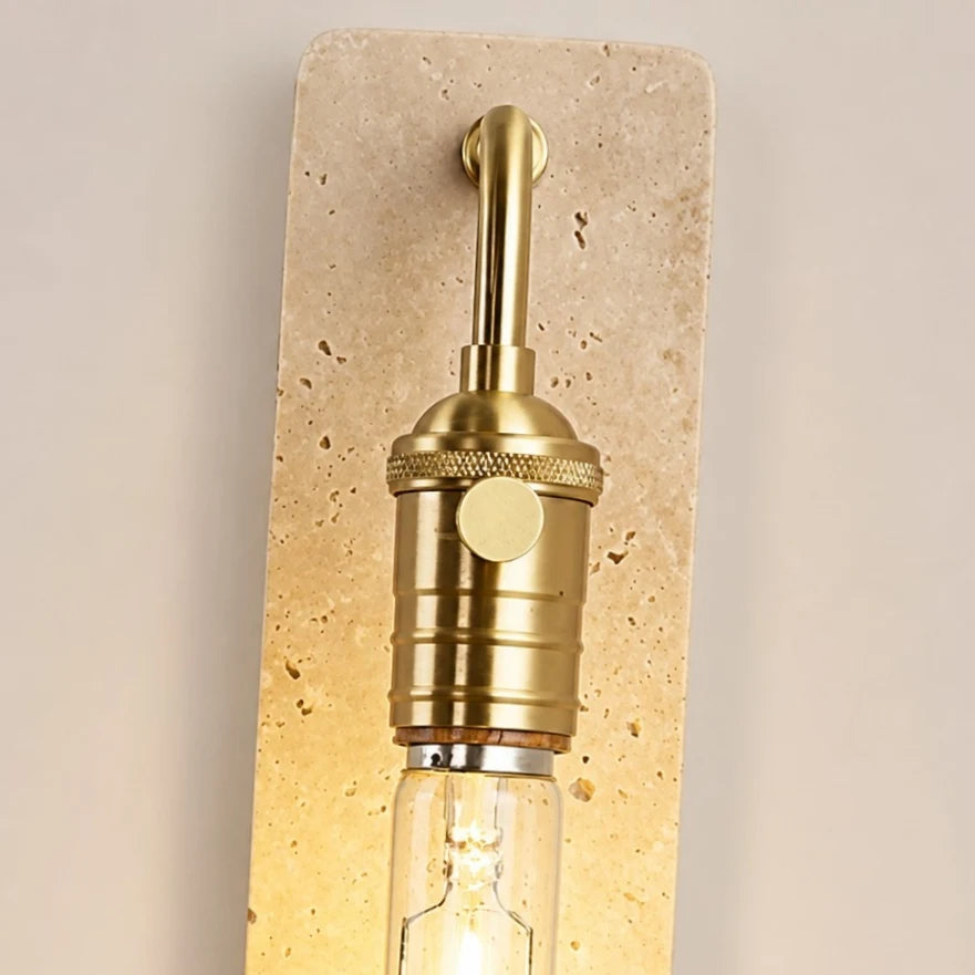 Gold socket switch and travertine face detail