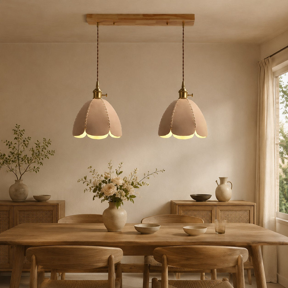 Two natural leather pendant lights above a dining table
