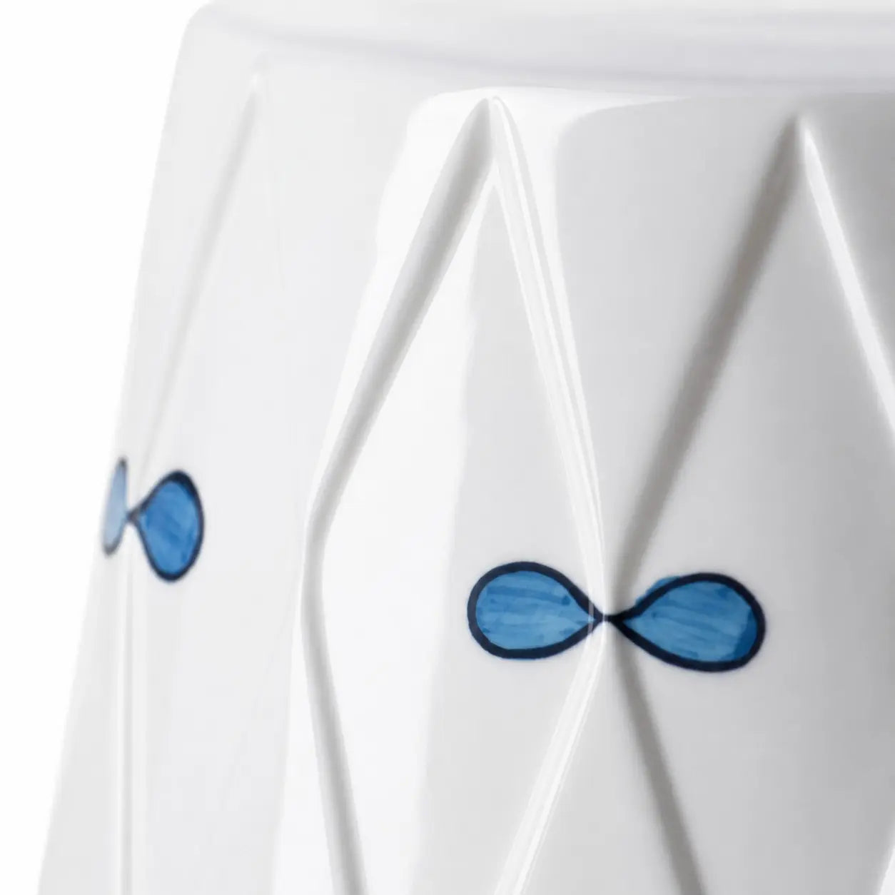 Close view of blue bow motifs and ceramic relief