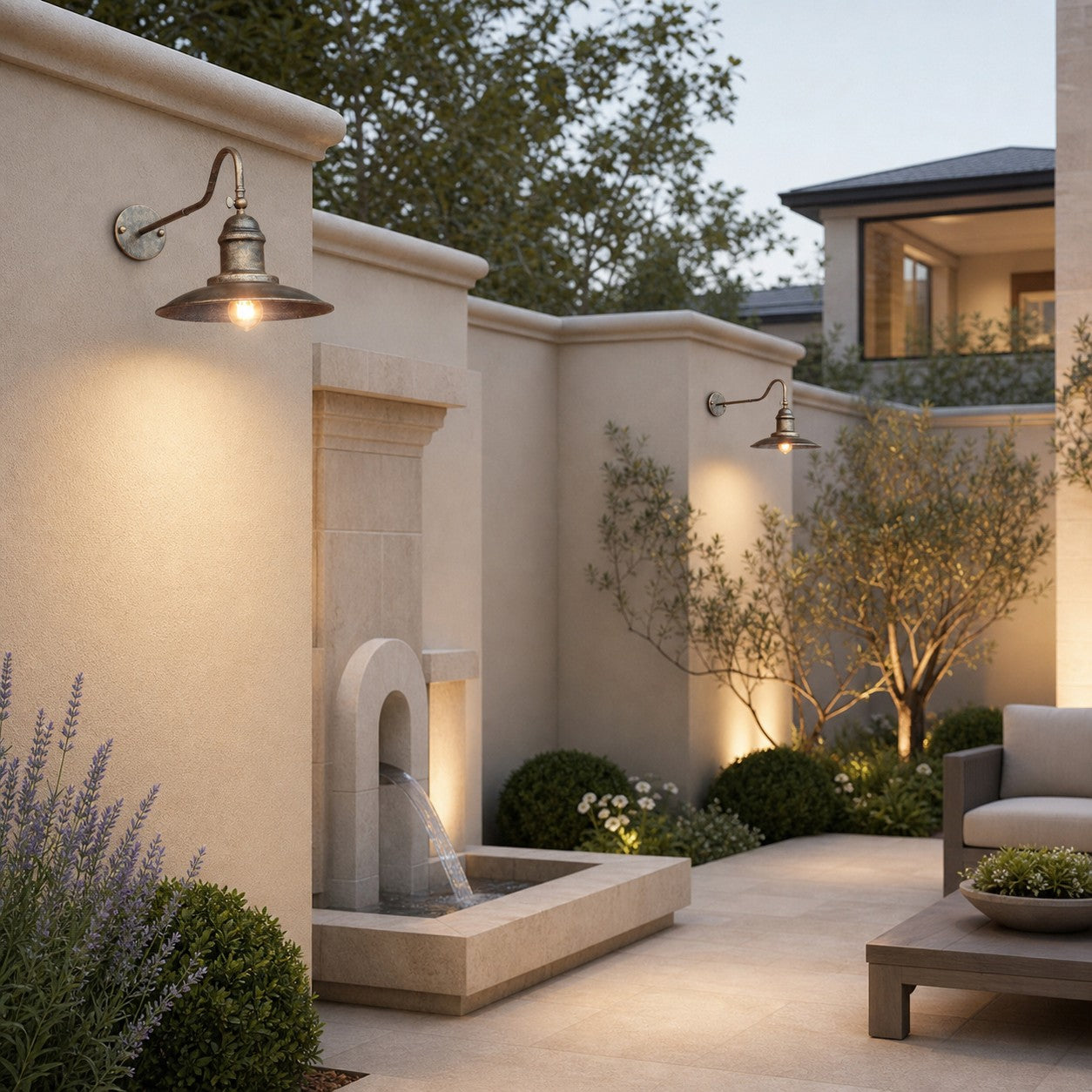 Outdoor wall sconces installed along a courtyard wall