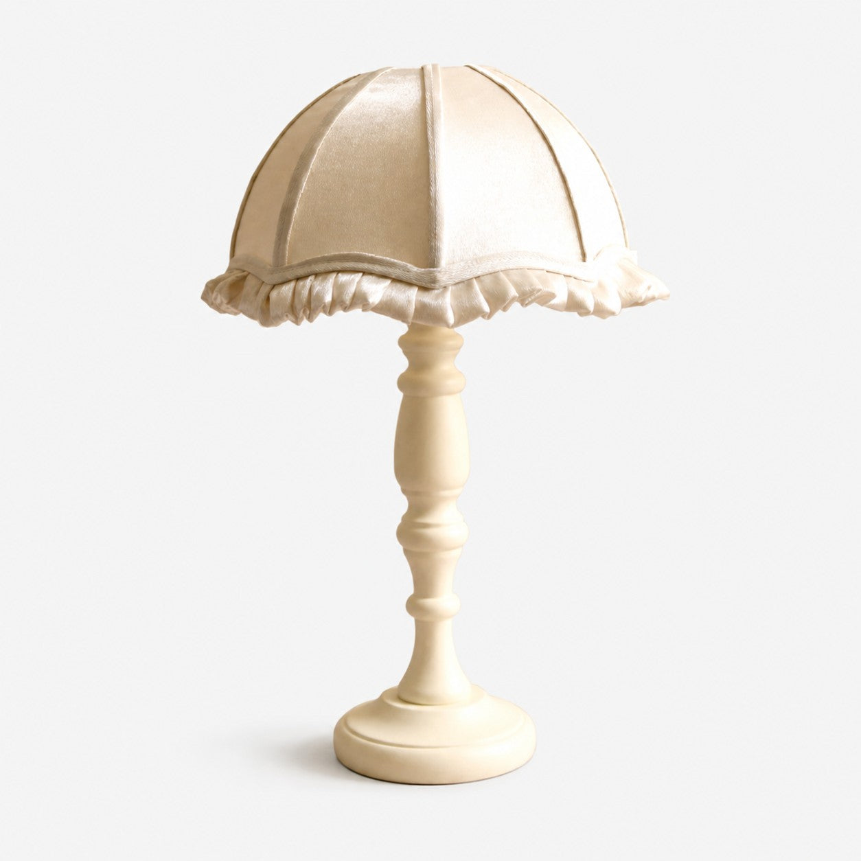 Cream fabric shade wood table lamp on white background