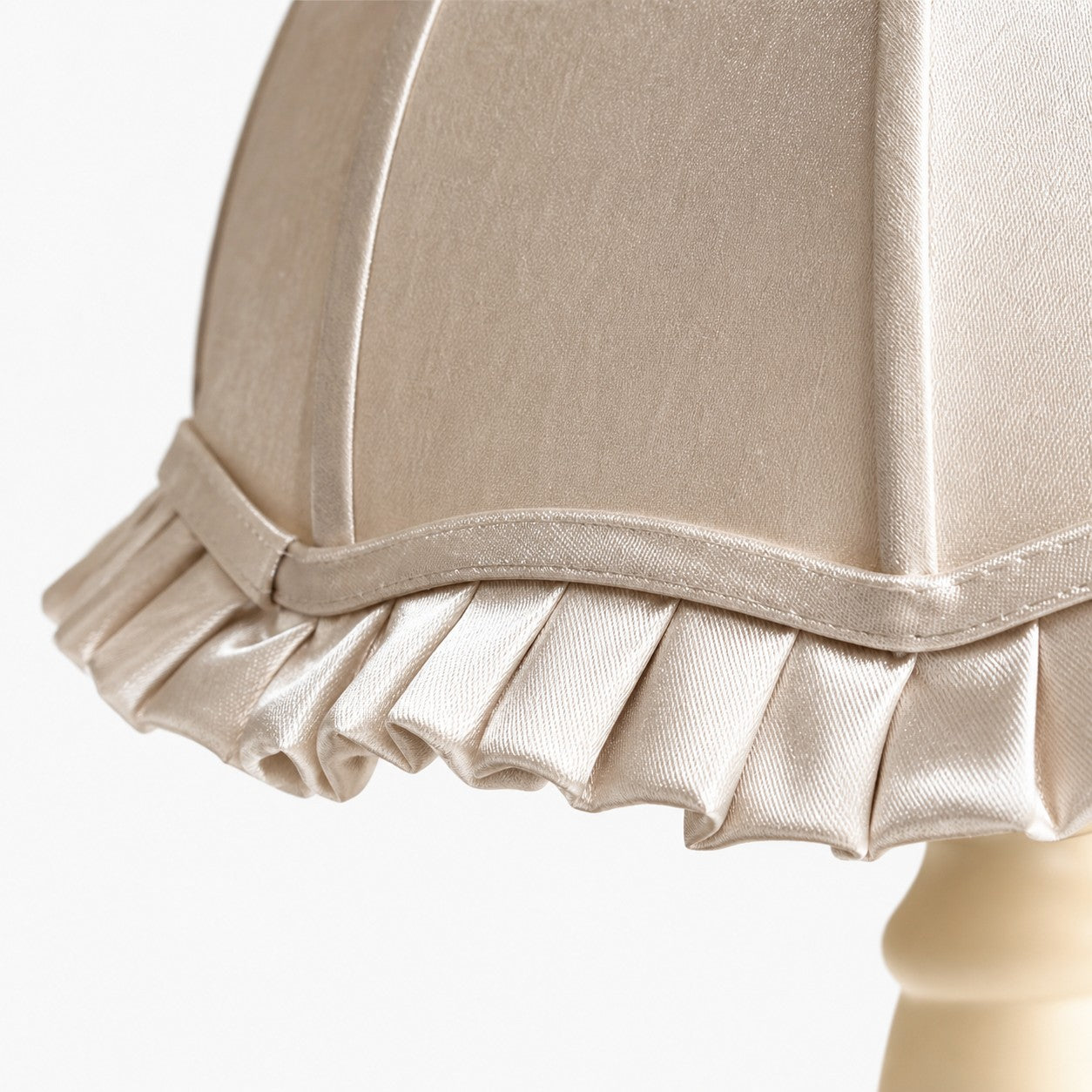 Close view of the ruffled fabric shade edge