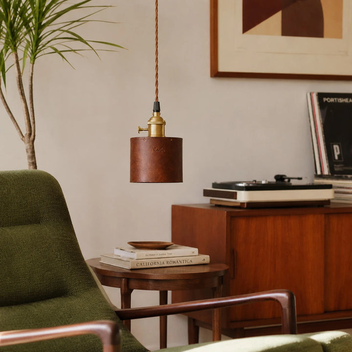 Brown leather pendant lamp in a vintage living room corner