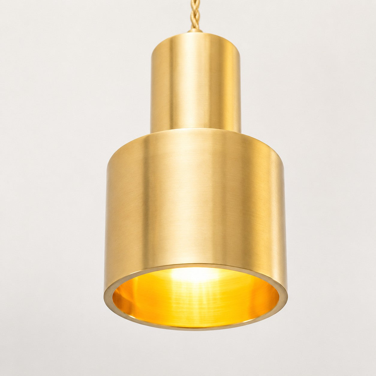 Close view of the brass shade and warm inner rim