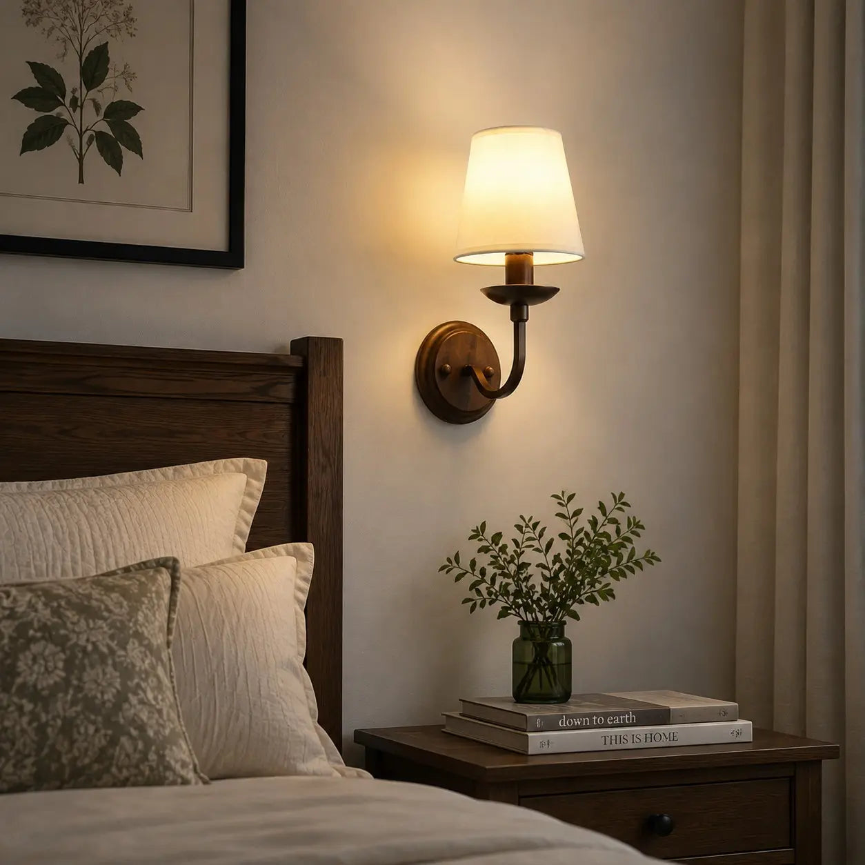 Warm bedside setting with an antique bronze wall sconce