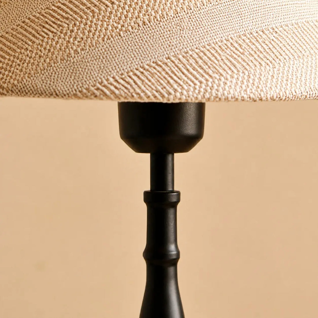 Close-up of the fabric shade and lamp frame connection