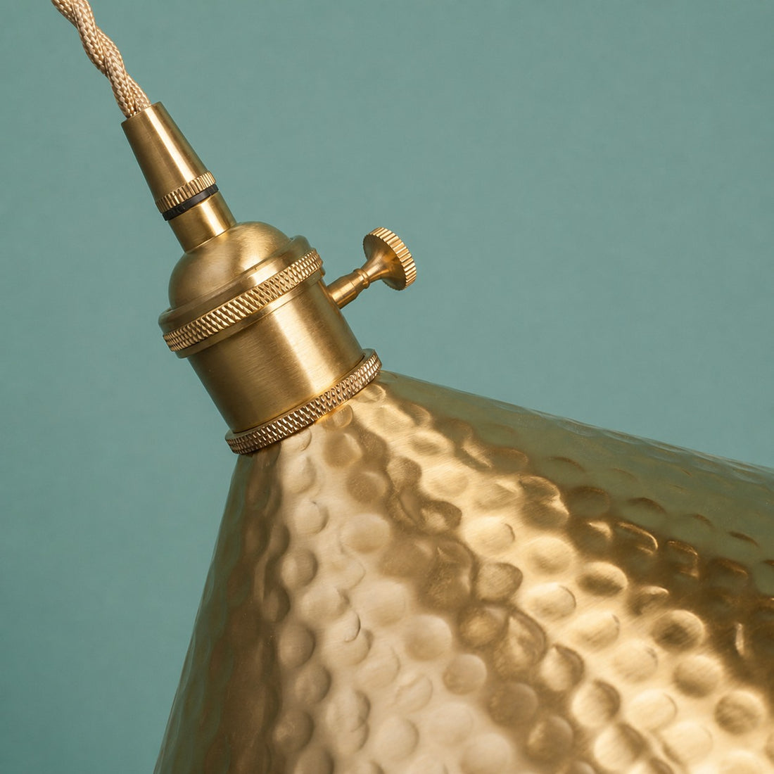 Hammered brass shade and socket hardware detail