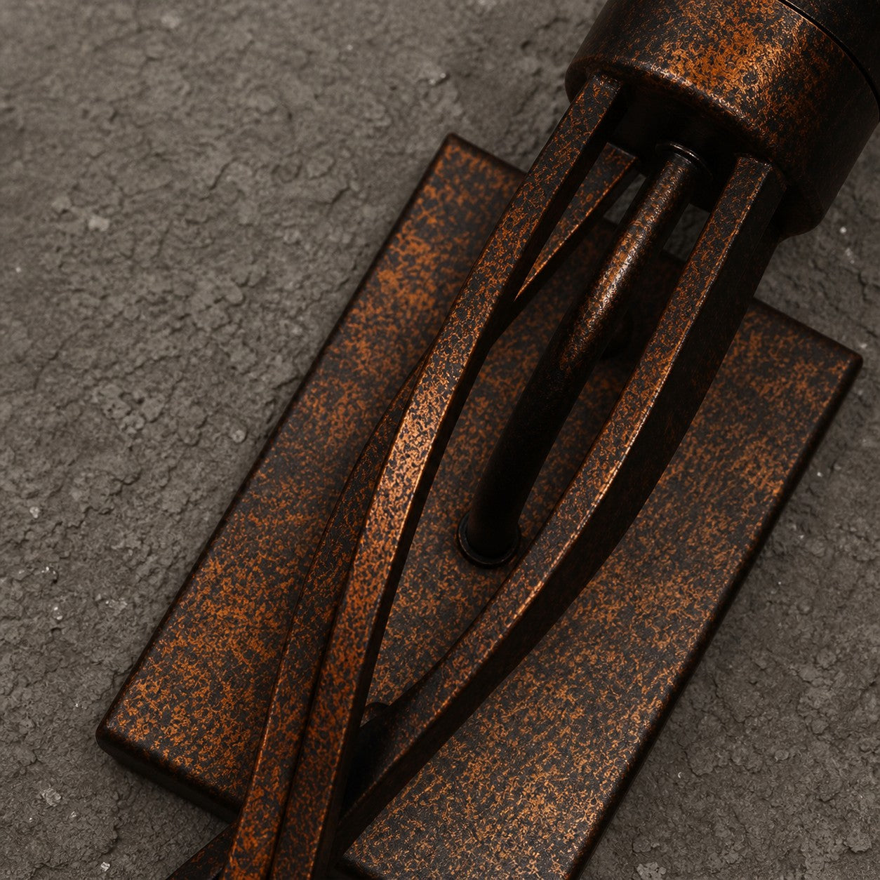 Close view of aged bronze metal texture and backplate