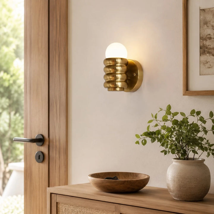 Installed bedside wall sconce in bedroom