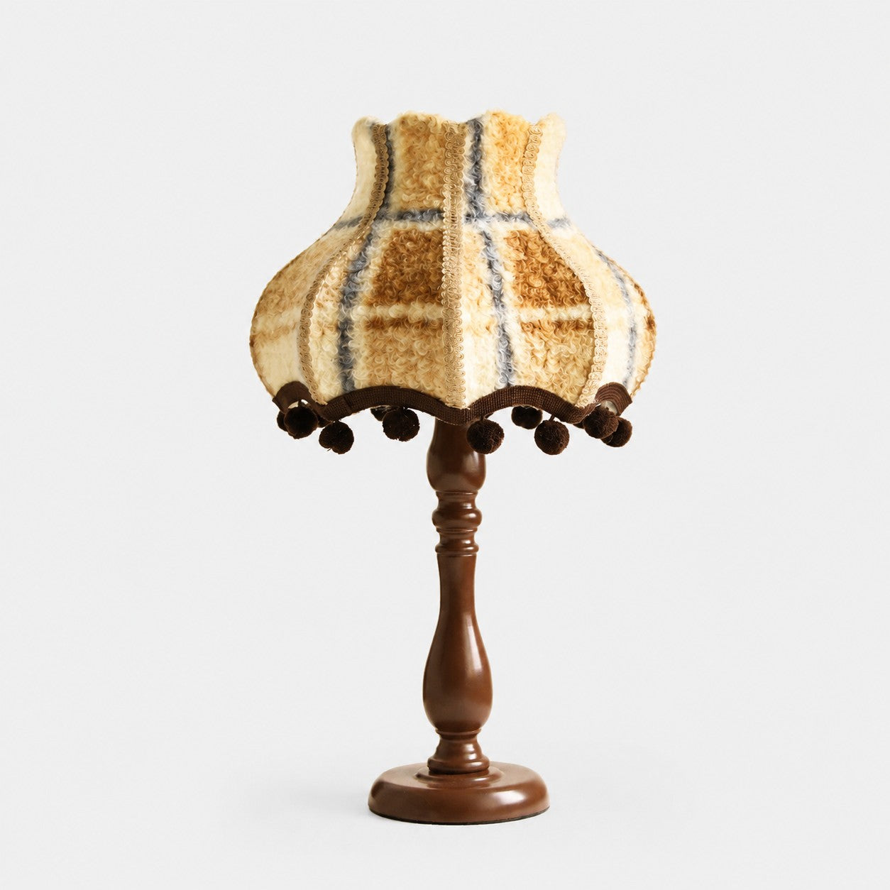 Vintage warm blue plaid fabric table lamp on white background