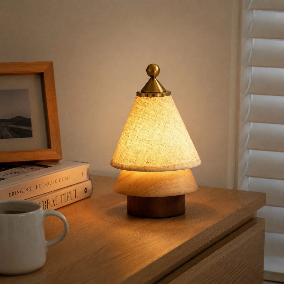 Rechargeable table lamp glowing on a bedside cabinet