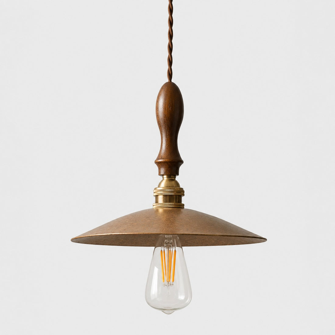 Hammered brass pendant with walnut wood on white background