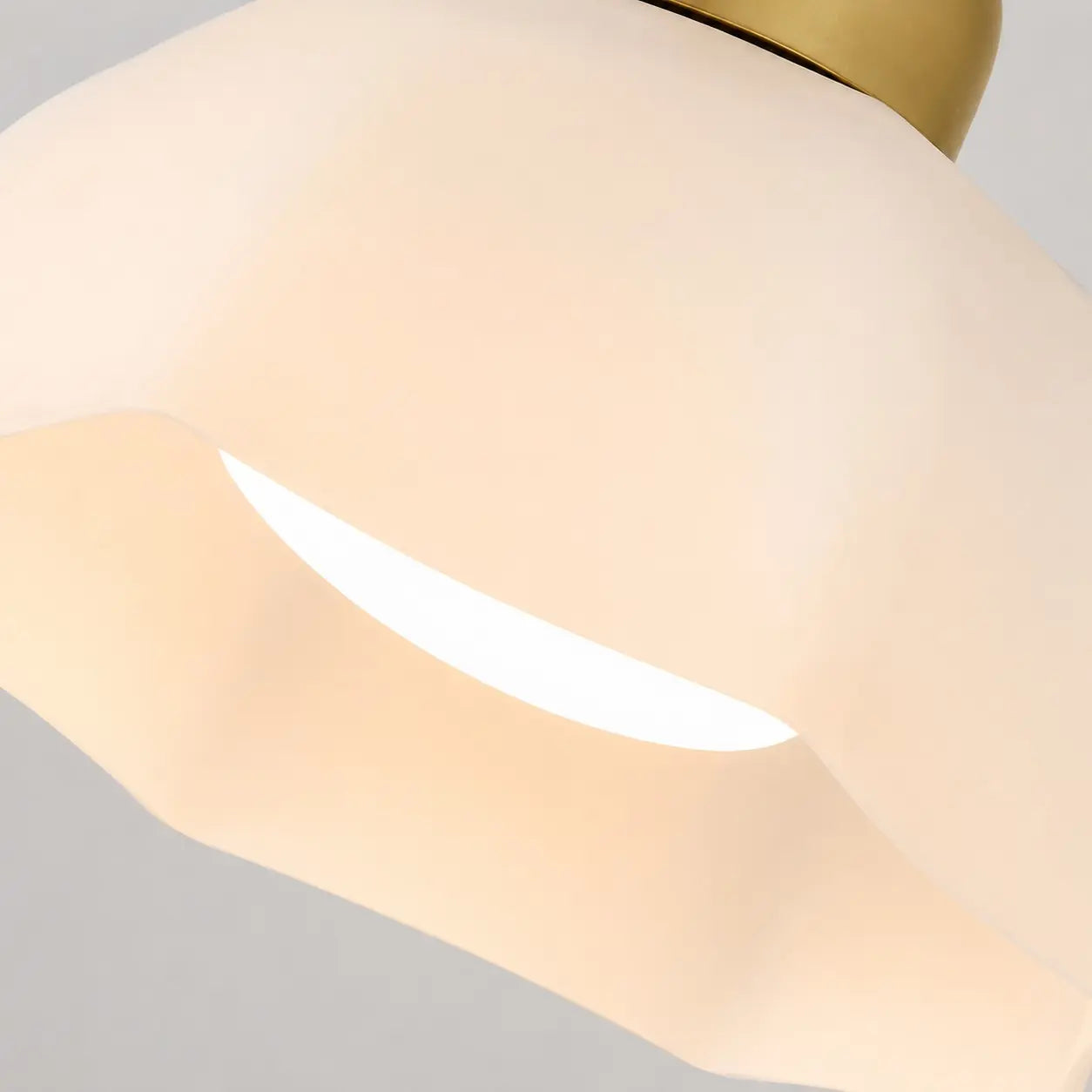 Close-up of the curved gold-tone metal frame