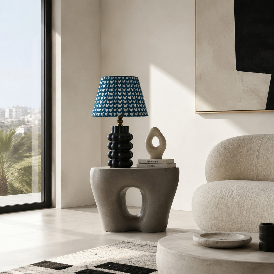 Sculptural ceramic table lamp on a living room side table