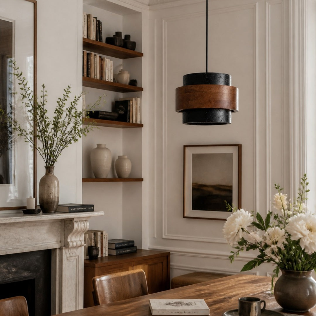 Black and walnut travertine pendant installed above a dining table