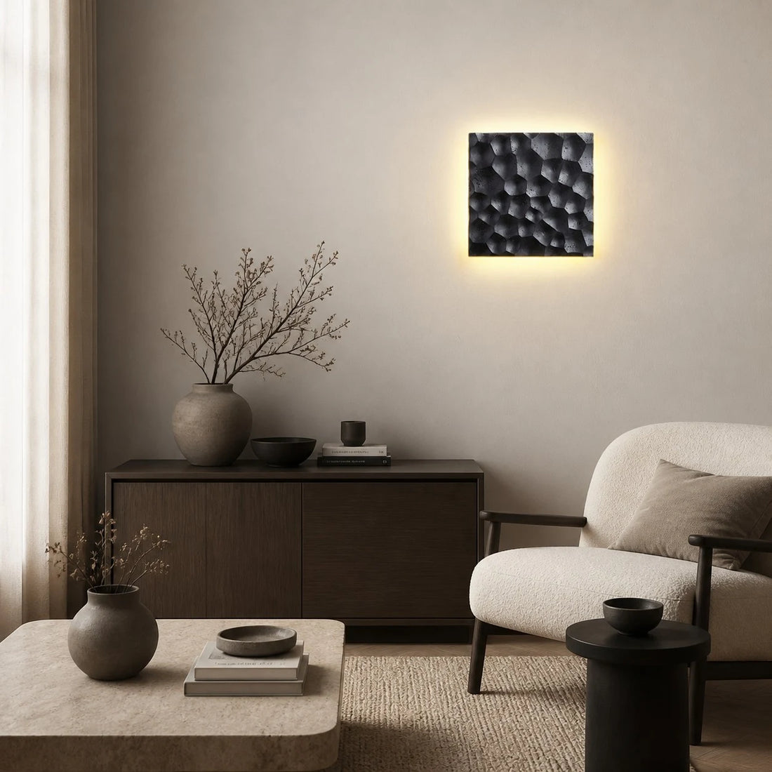 Square travertine wall sconce used as bedside ambient lighting