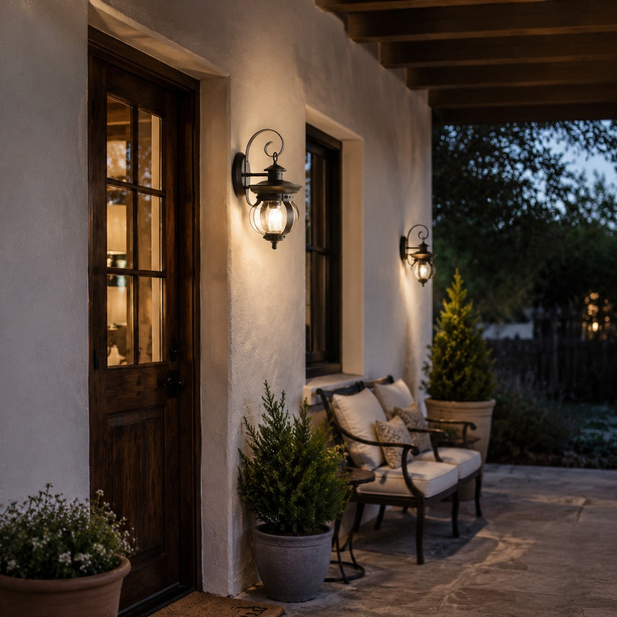 Pair of black wall lanterns beside an exterior doorway