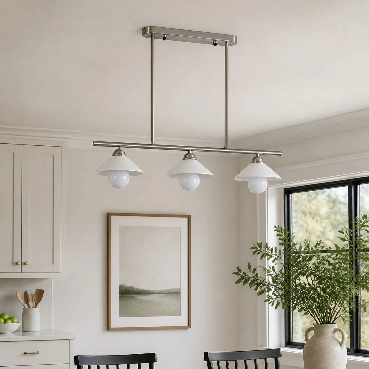 Three-head pendant above a calm dining space