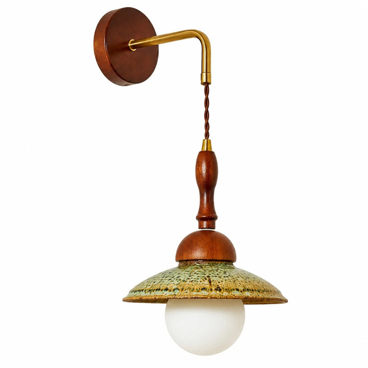 Side view of the Japanese wabi sabi wall sconce with round wooden backplate and brass wall arm