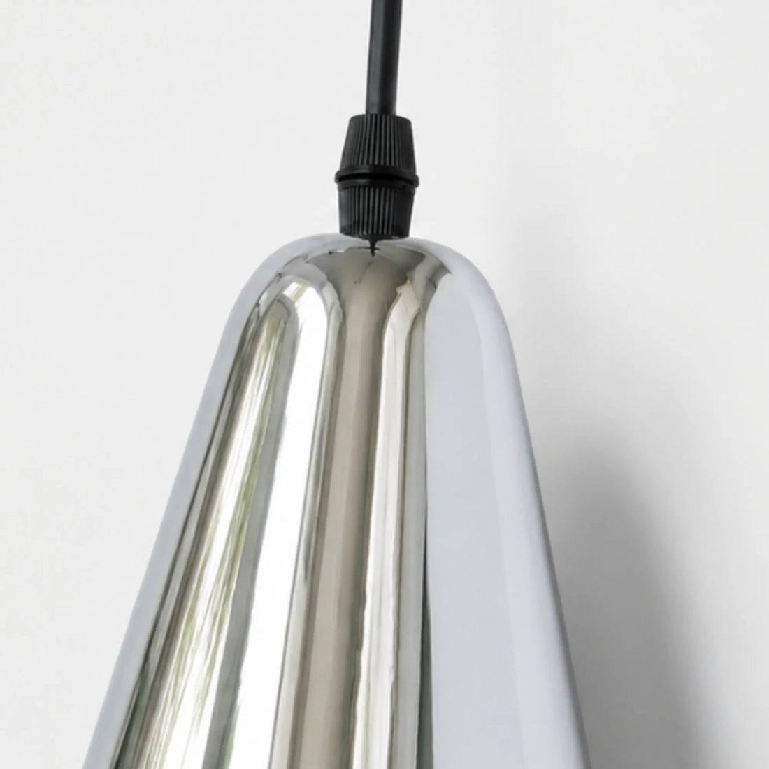 Polished chrome shade edge and cord entry detail