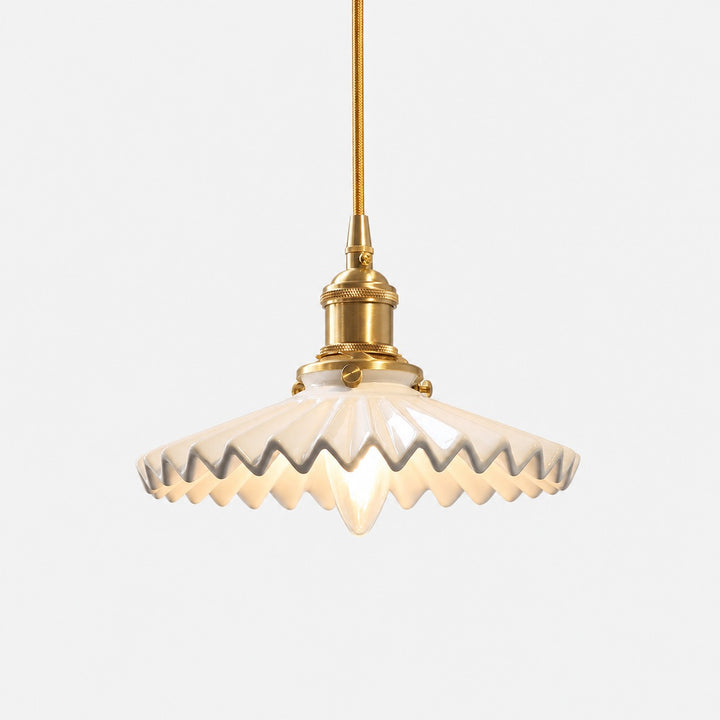 White pleated ceramic pendant light with brass-finish base