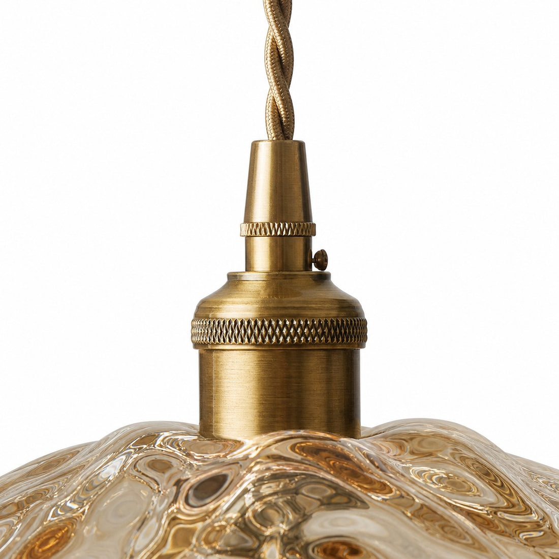 Close-up of antique brass socket and twisted cord