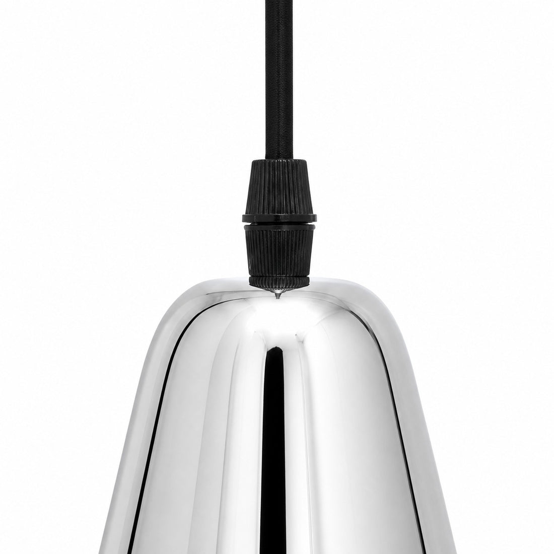 Close-up of the black socket holder and chrome brass shade connection