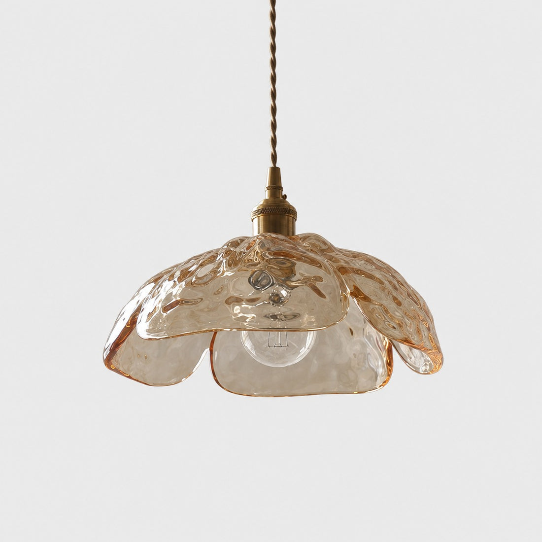 Single amber pressed-glass flower pendant with brass socket