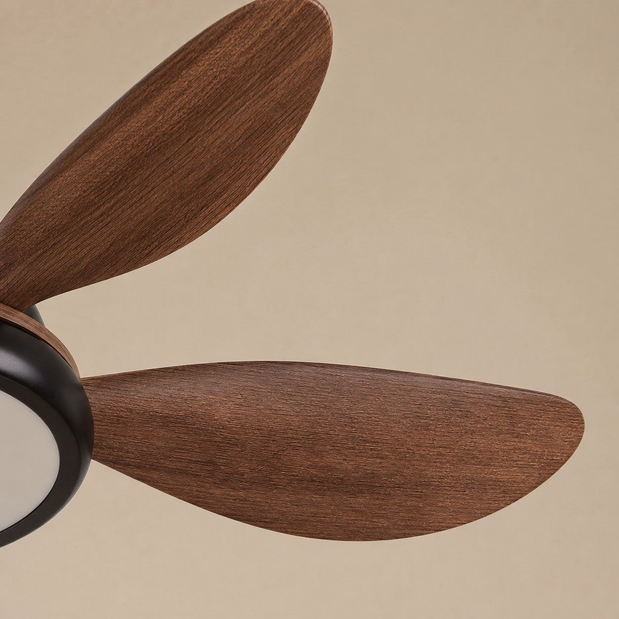 Wood-grain ceiling fan blade close detail