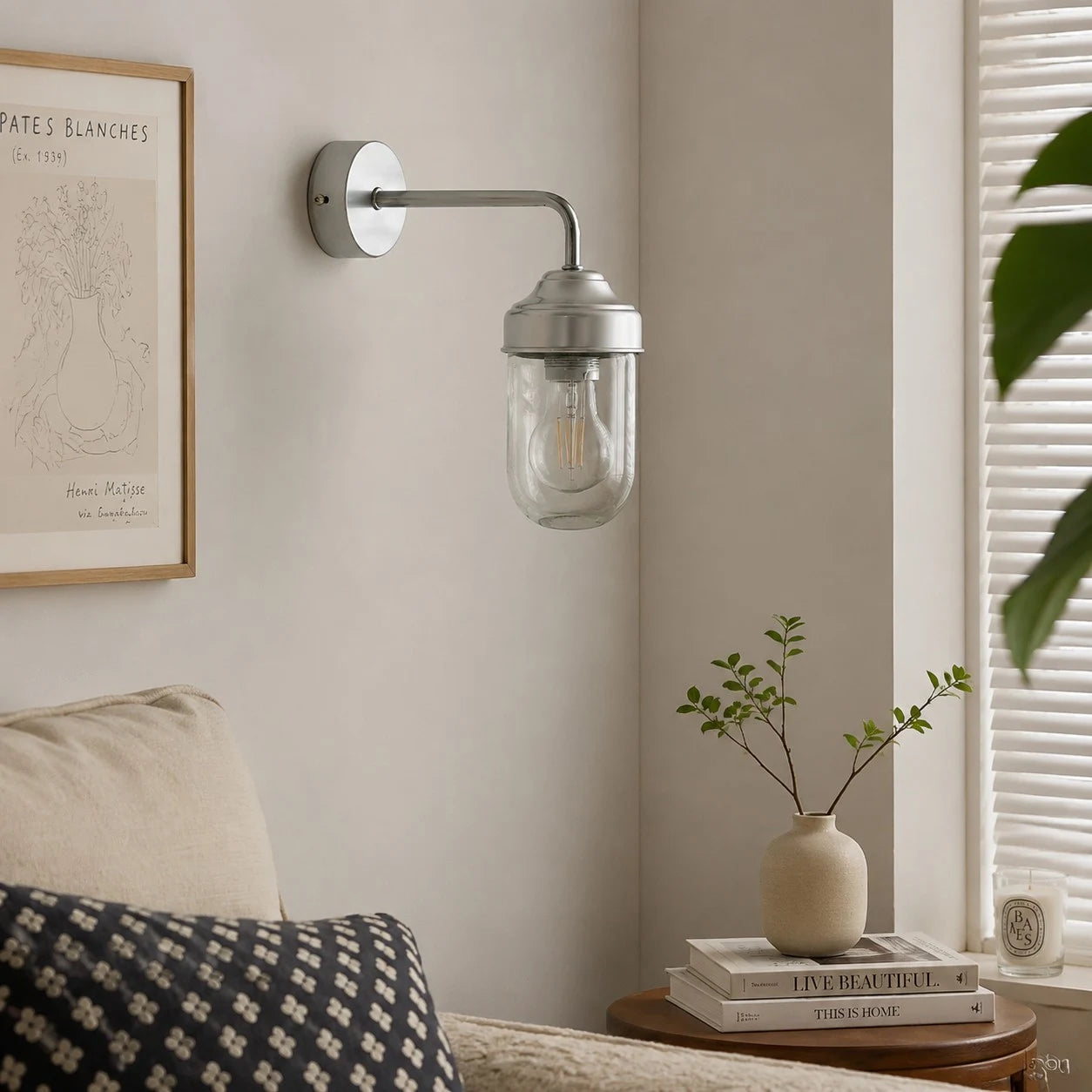 Aluminum glass wall sconce in a calm interior corner
