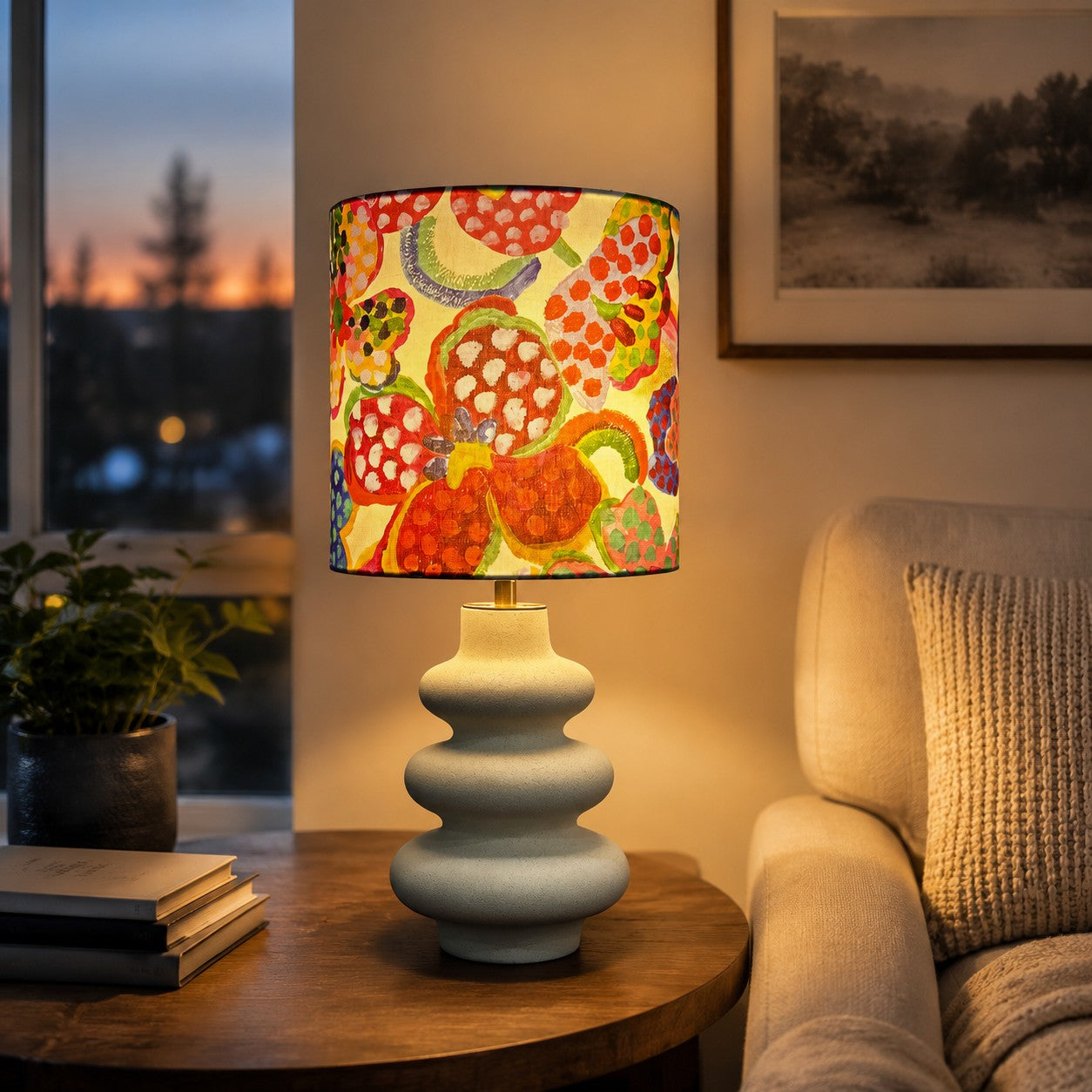 Floral fabric shade ceramic table lamp on a console table
