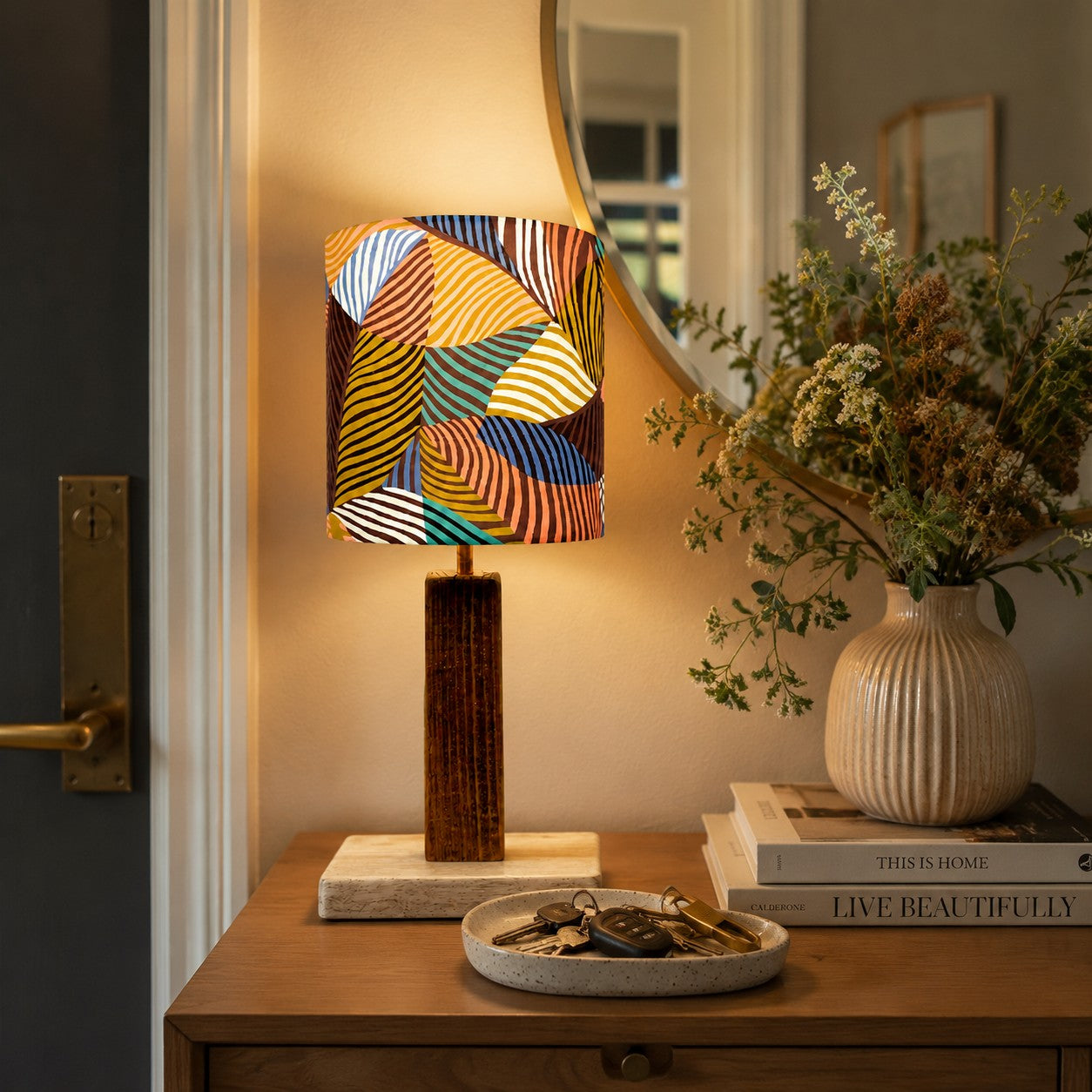 Colorful printed fabric table lamp in a styled interior