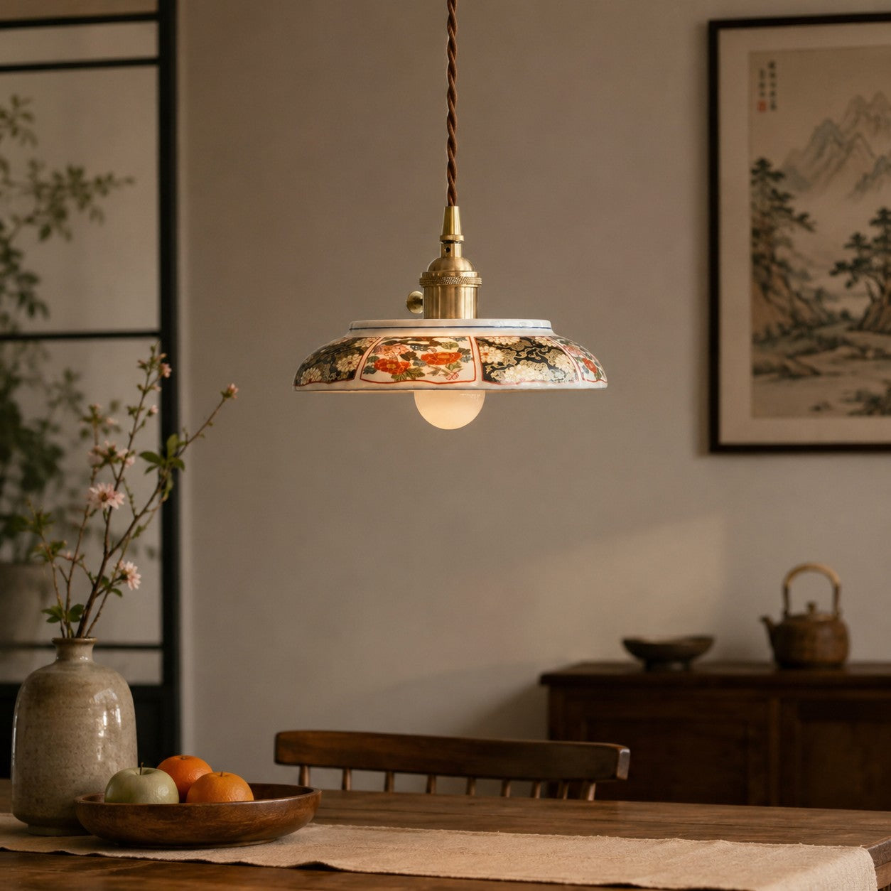 Ceramic pendant lamp in a warm tea-room setting with wall art background