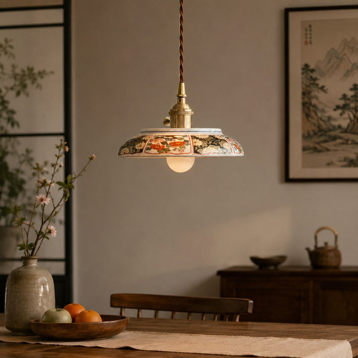 Ceramic pendant lamp in a warm tea-room setting with wall art background