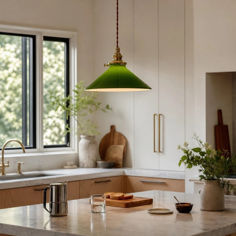 Green glass pendant lamp above a kitchen counter