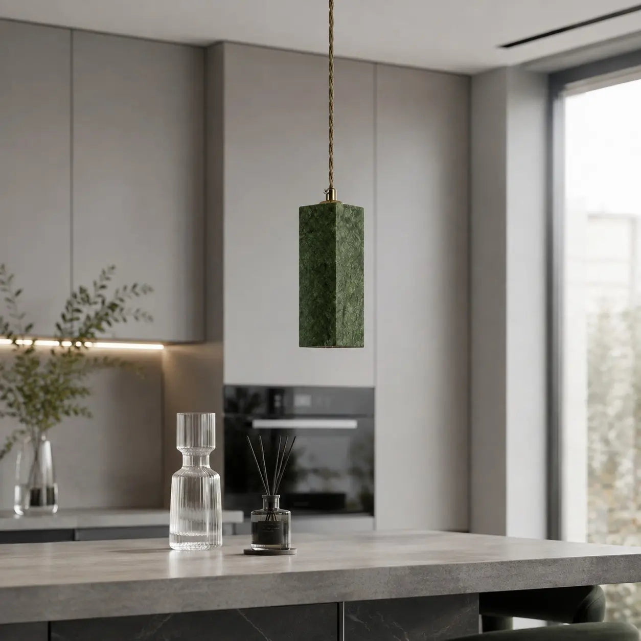 Green jade pendant light in a modern kitchen