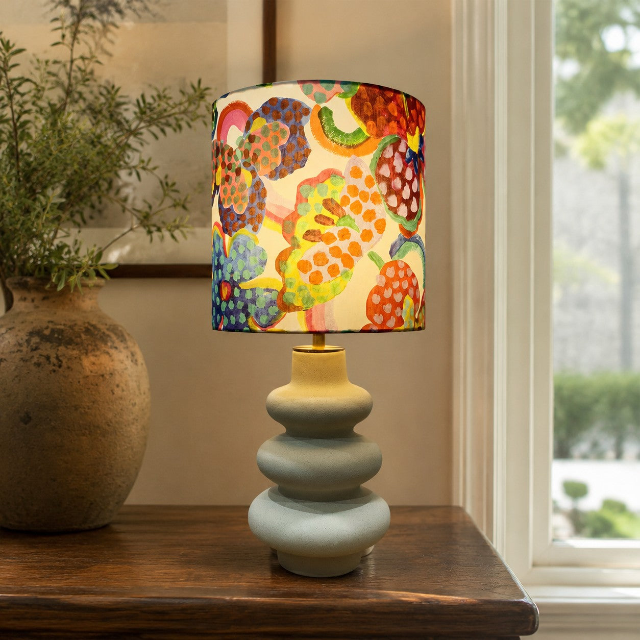 Sculptural ceramic base and floral fabric shade table lamp