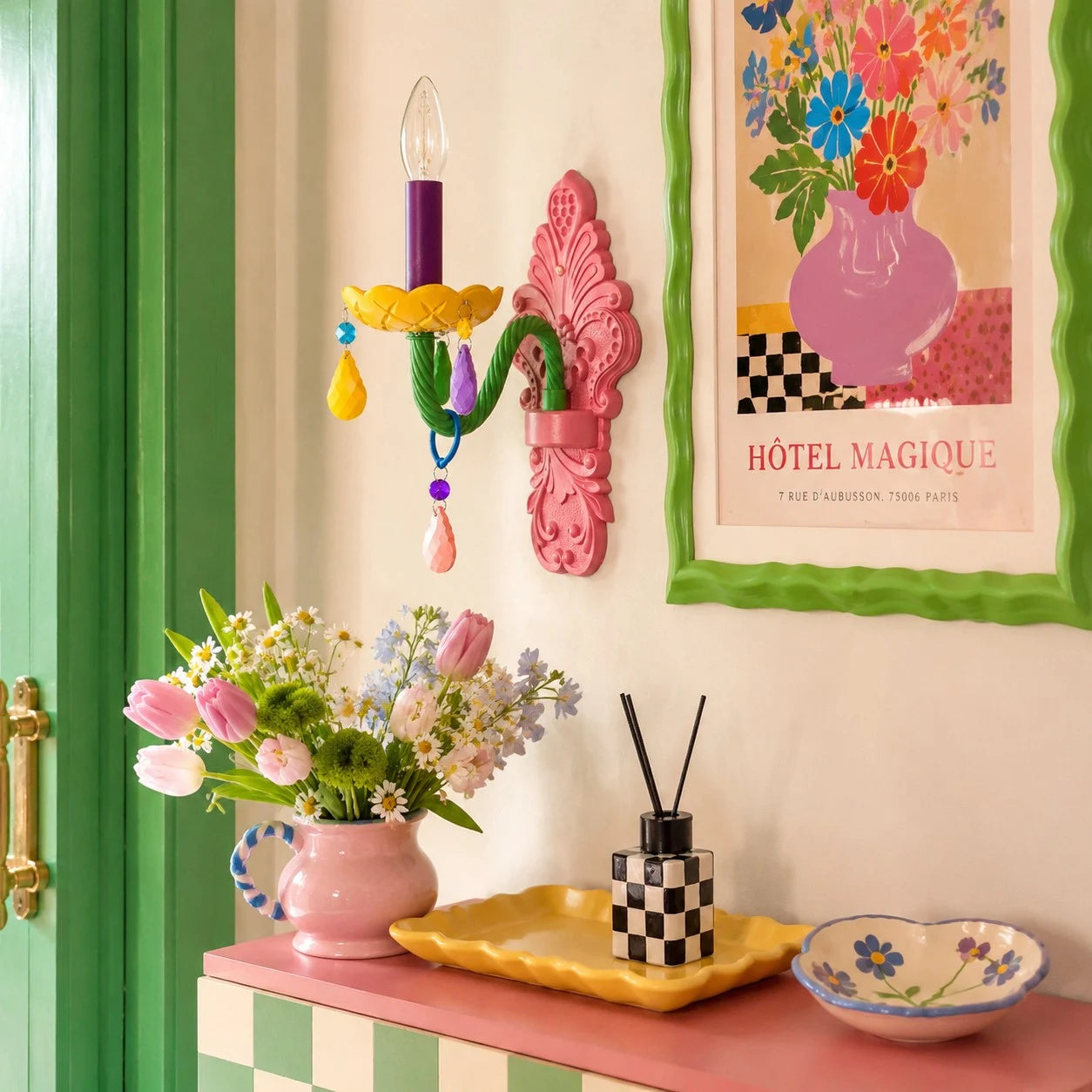 single-head colorful wall sconce styled above a console