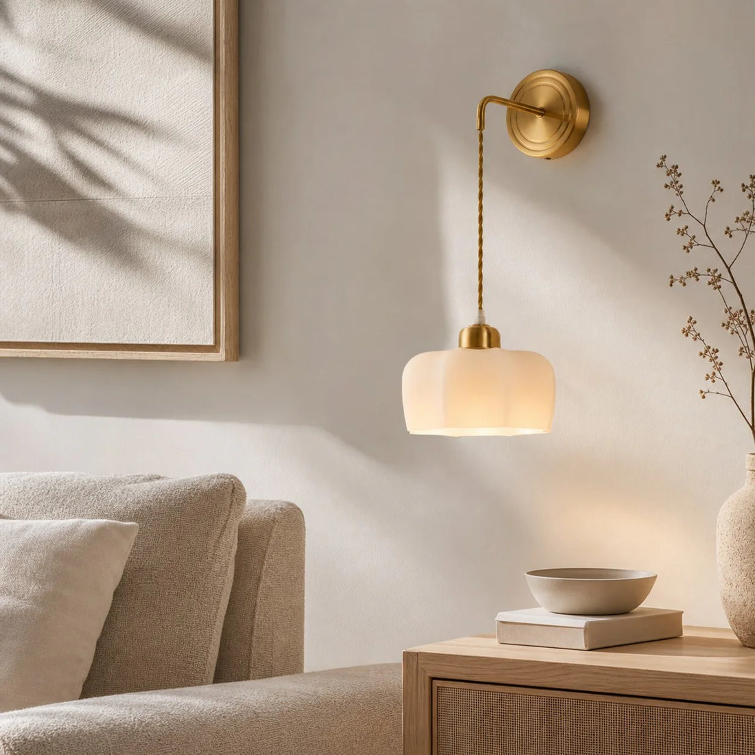 Scalloped shade wall sconce installed in a living room