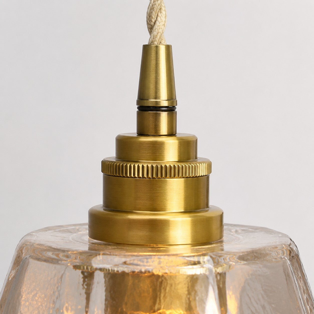 Antique brass lamp holder close-up on faceted glass shade