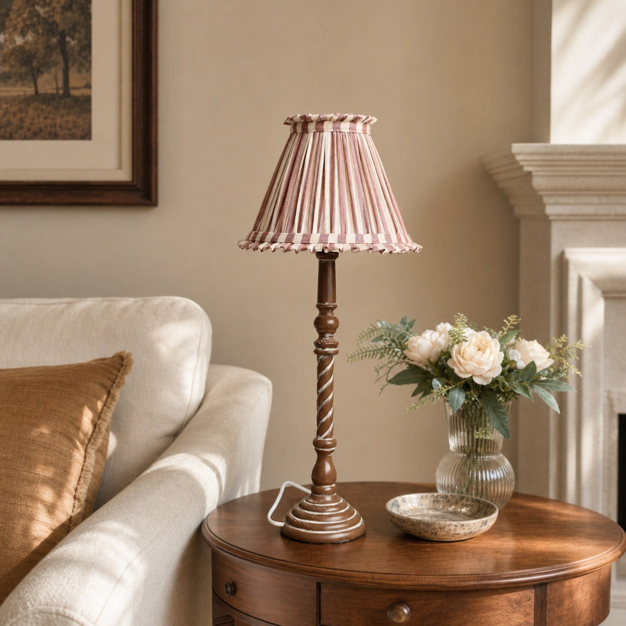 Pink striped French country table lamp in living room side table setting