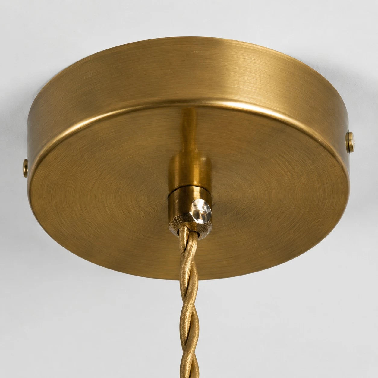 Brass-tone ceiling canopy detail