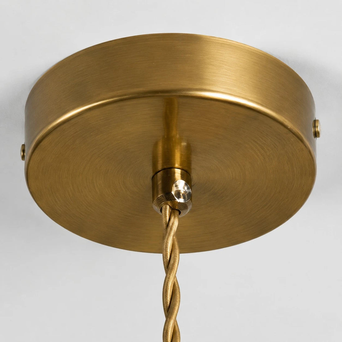 Brass-tone ceiling canopy detail