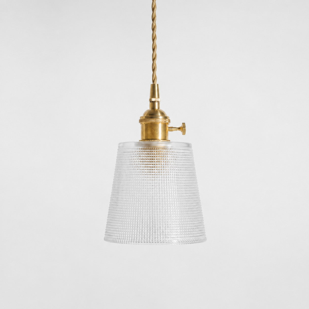 Style B textured glass shade with antique brass E27 socket, front view