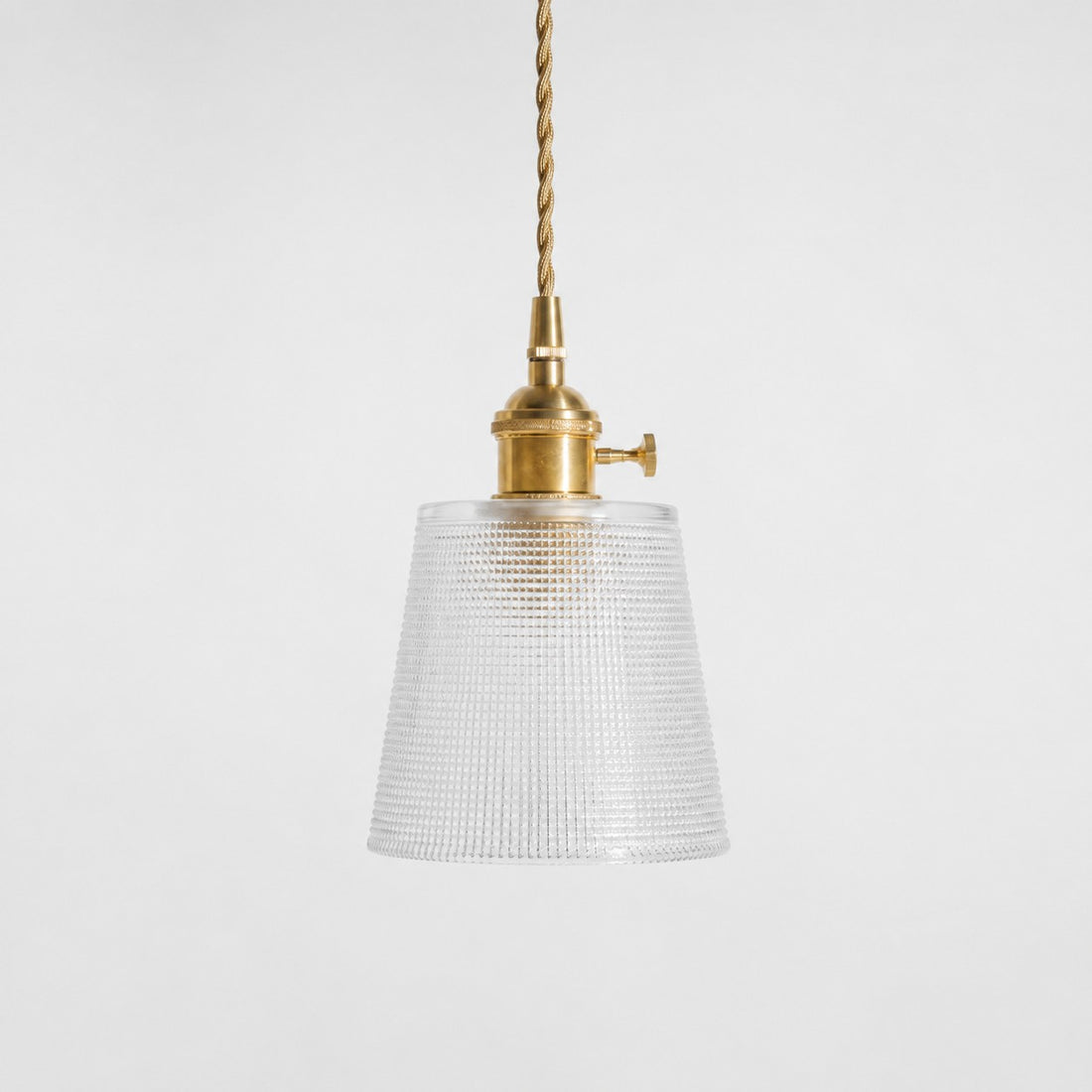 Style B textured glass shade with antique brass E27 socket, front view