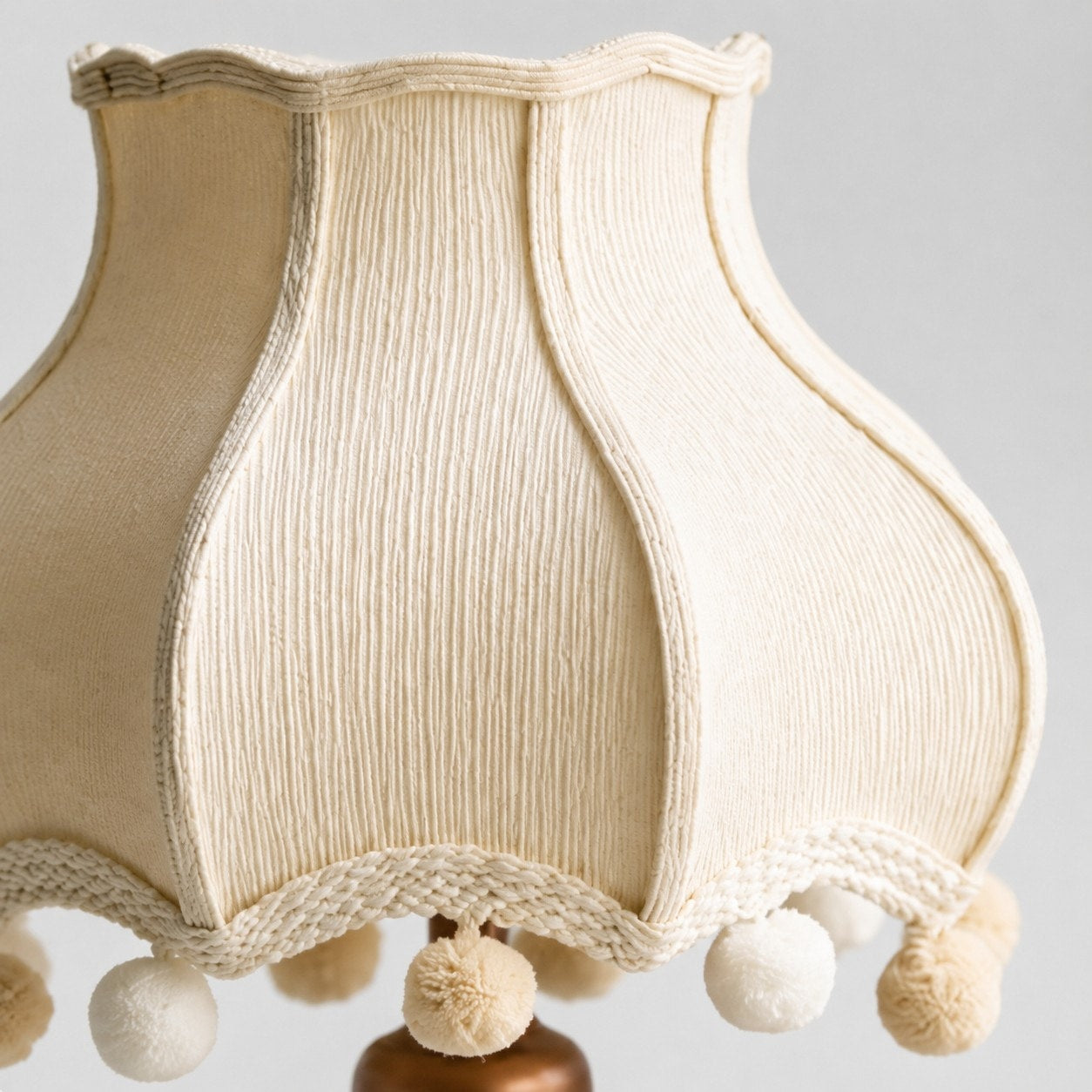 Cream fabric shade edge and pom-pom detail