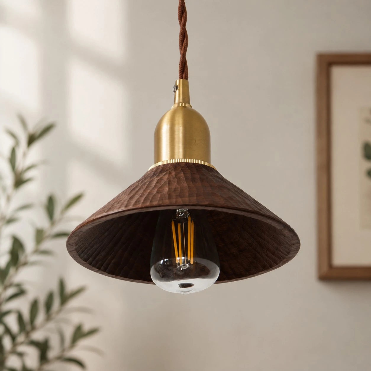 Black walnut carved pendant shade shown in a bright interior
