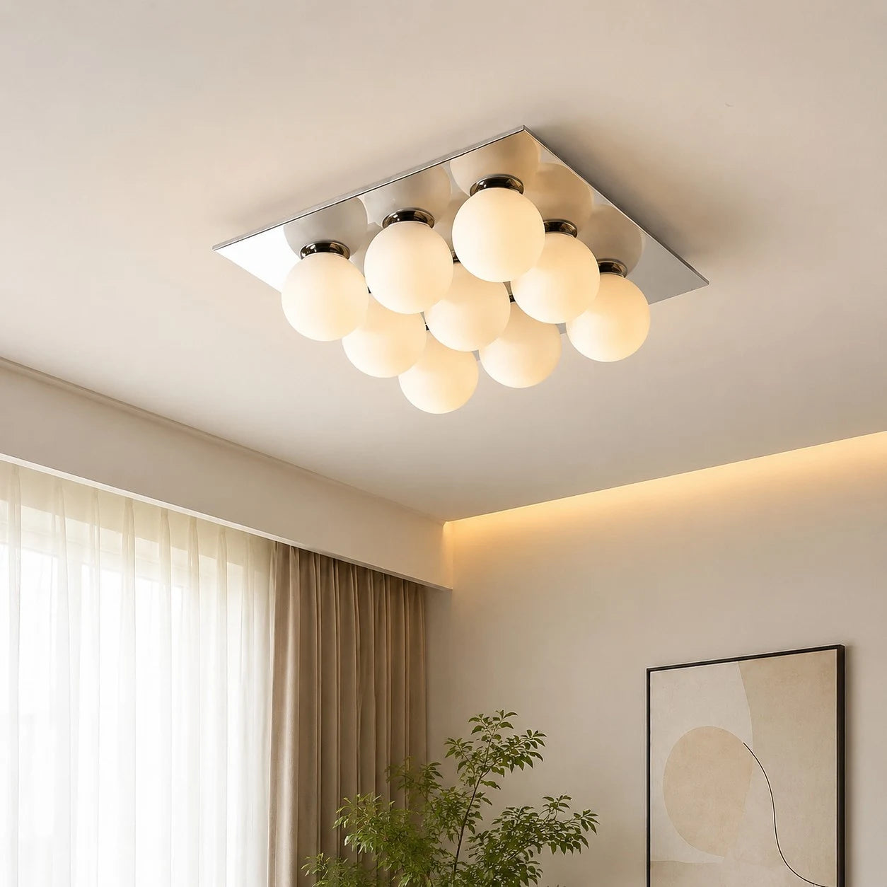 Main gallery image: chrome square ceiling light installed in a warm living room, lights on.