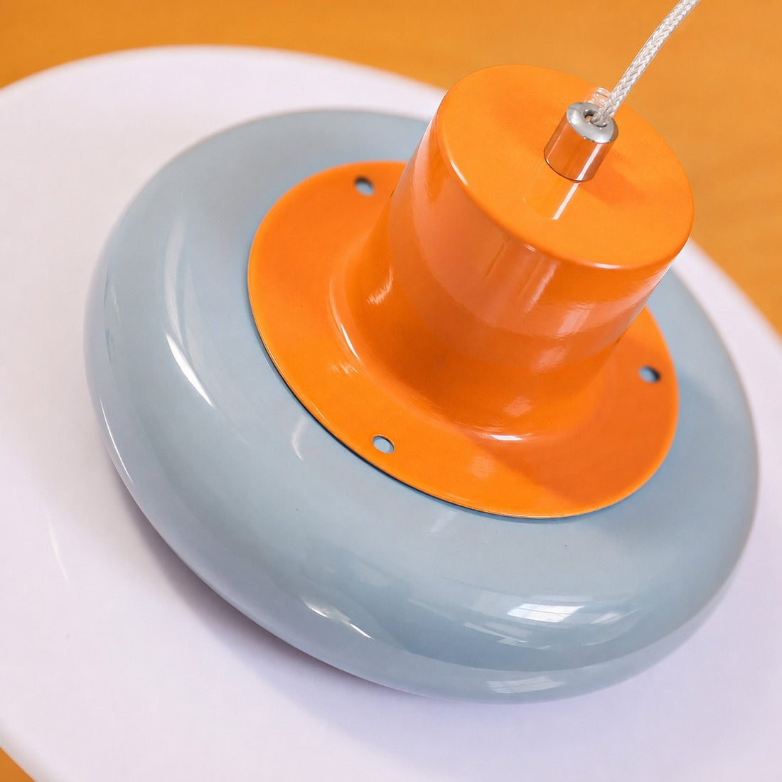 Close-up of glossy orange top and sea salt blue shade detail